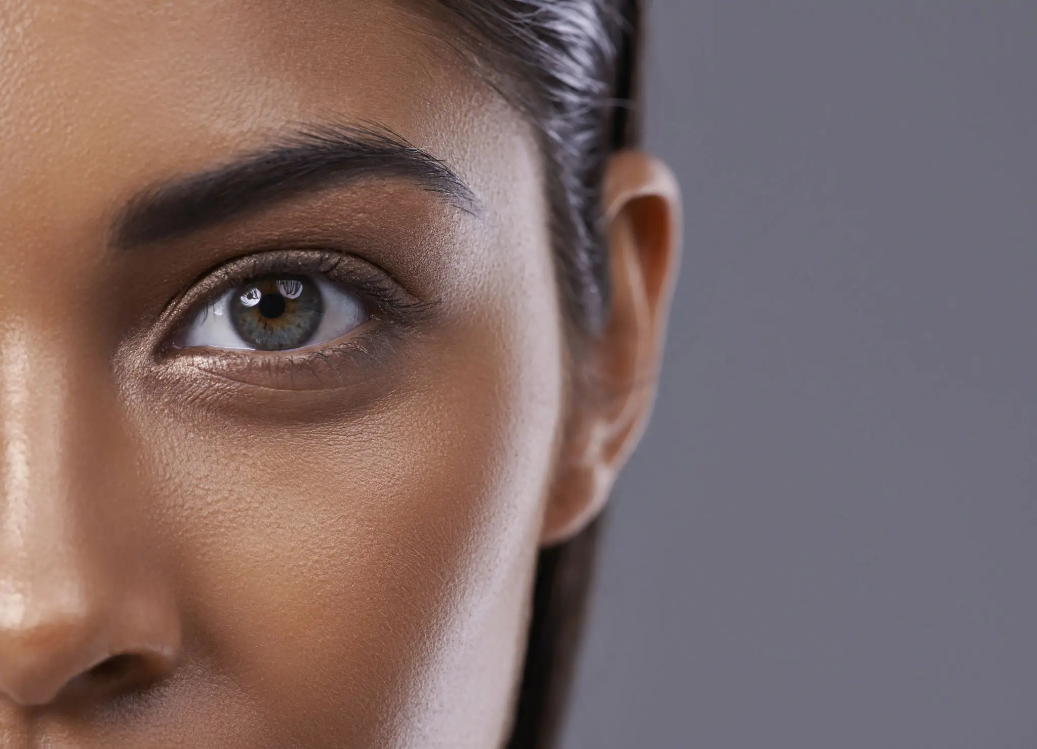 Close-up of a person's eye and skin.