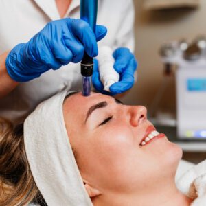 Facial treatment with a skin care tool.