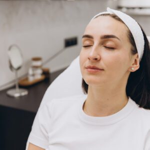 Woman relaxing in a spa treatment chair.